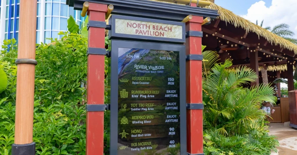 A board showing wait time in North beach pavilion in Volcano Bay